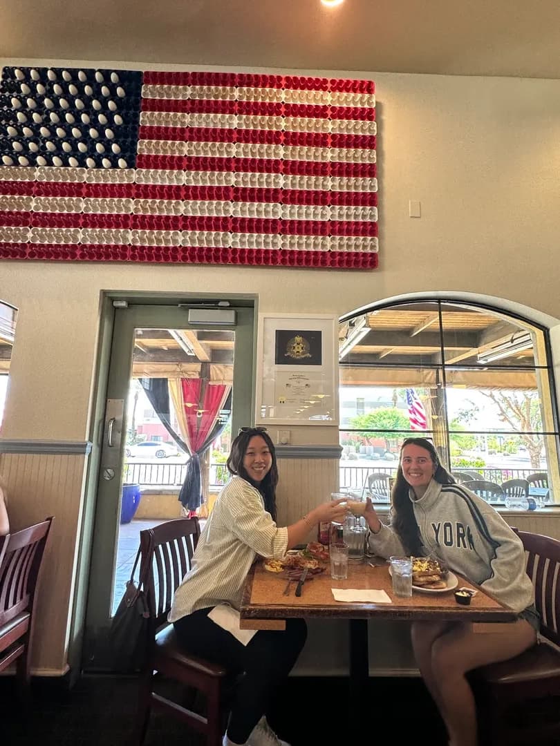 Friends celebrating with mimosas and toasts