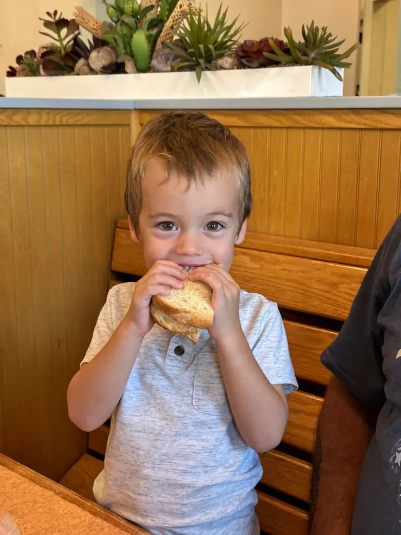 Delighted child with their favorite sandwich