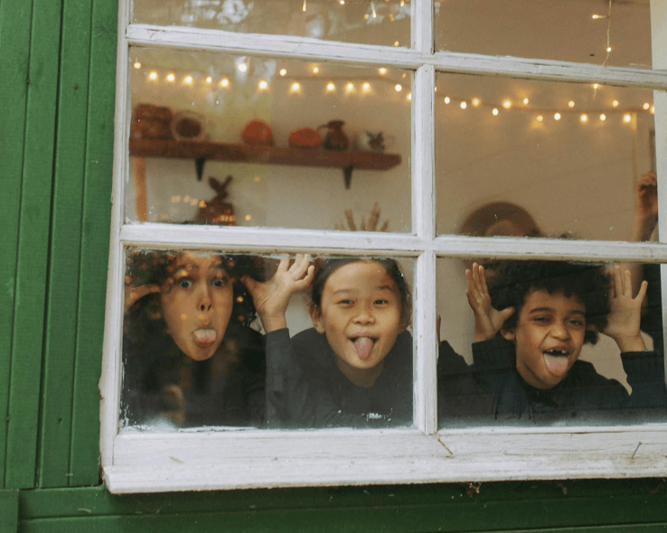 The Foster Alliance Holiday Toy Drive 2025 - Children looking out window promoting pajama donations